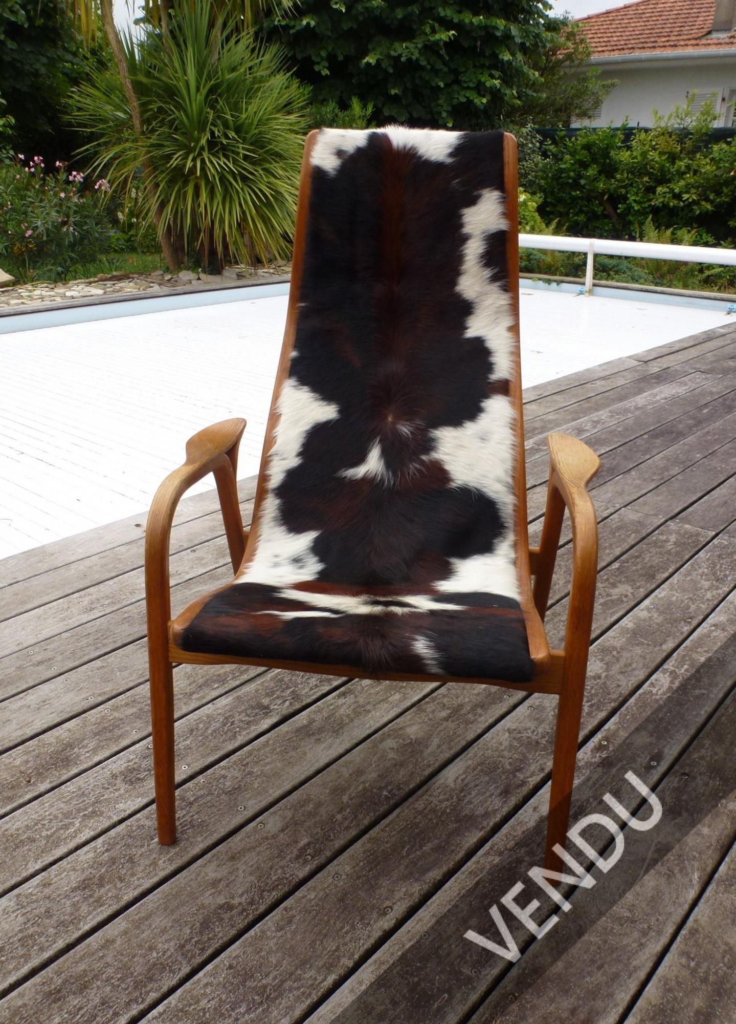 Made in Suede pour le fauteuil Lamino édité par Swedese structure en chêne et recouvert de peau